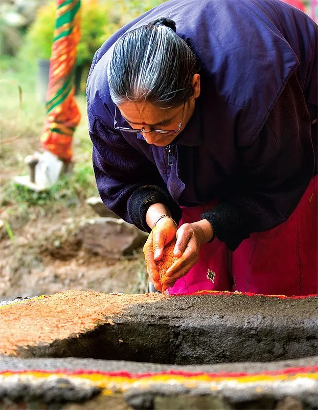 A devotee prepares the puja