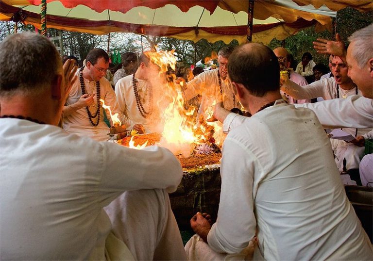 Swamis conduct a sacred fire ceremony at Guru's Samadhi