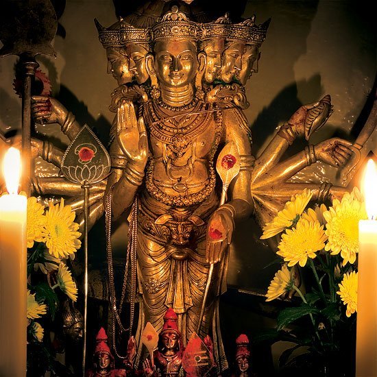 An exceptionally beautiful image of Lord Shanmukha with candles at Skanda Vale