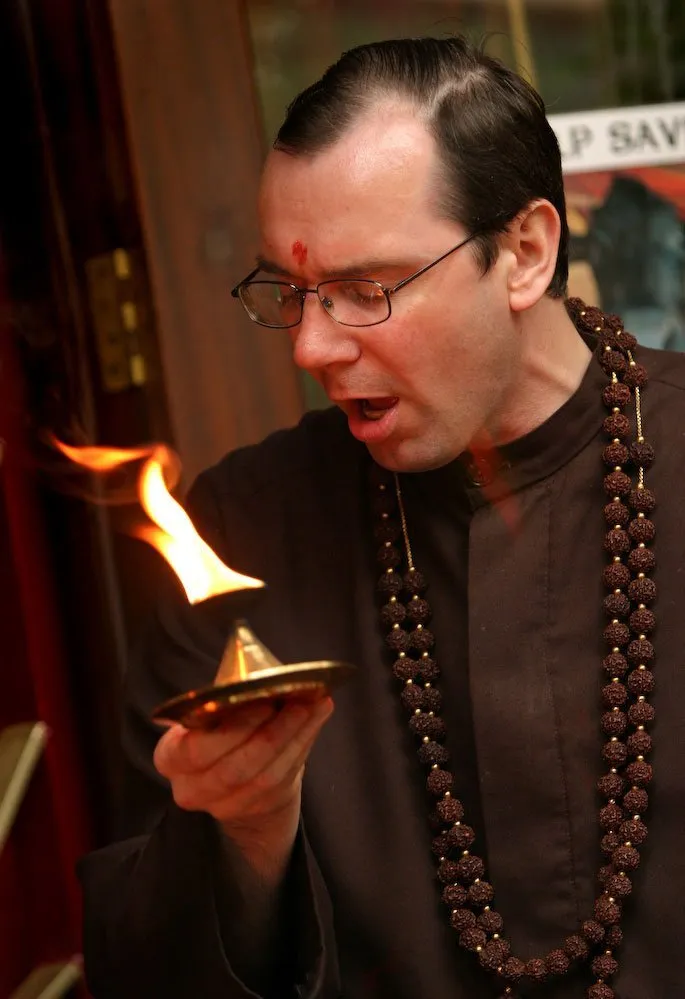Swami Suryananda with the aarthi flame during a peaceful demonstration to celebrate the sanctity of life, during the Shambo case, at Skanda Vale