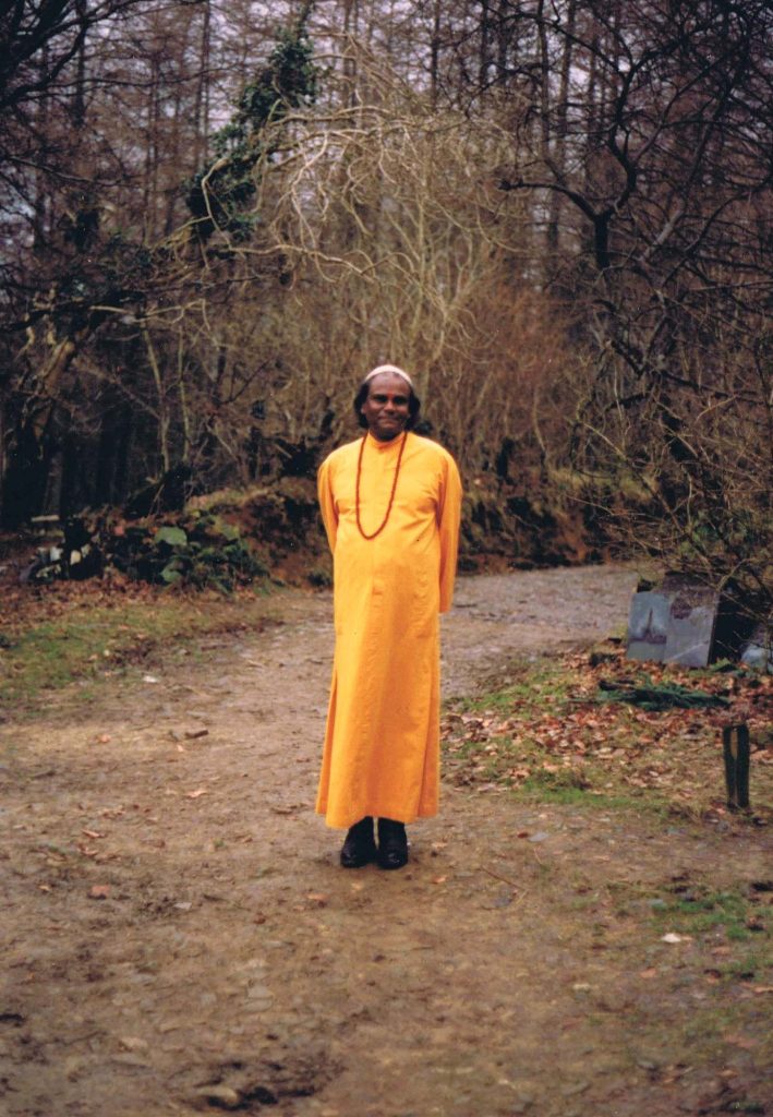 Guru Sri Subramanium in an orange robe at Skanda Vale.