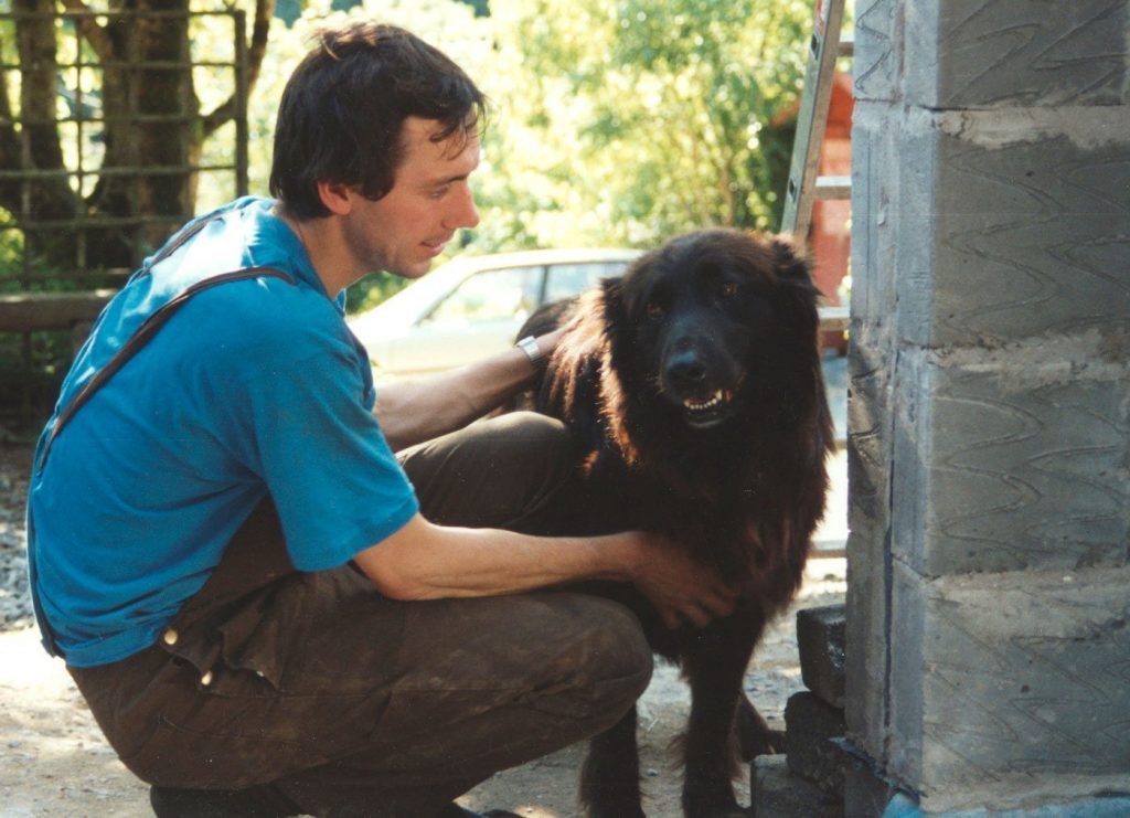 Lester, an Alsatian / Newfoundland cross dog with Swami Suryananda