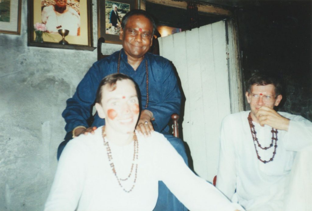 Guru Sri Subramanium with two swamis in white robes