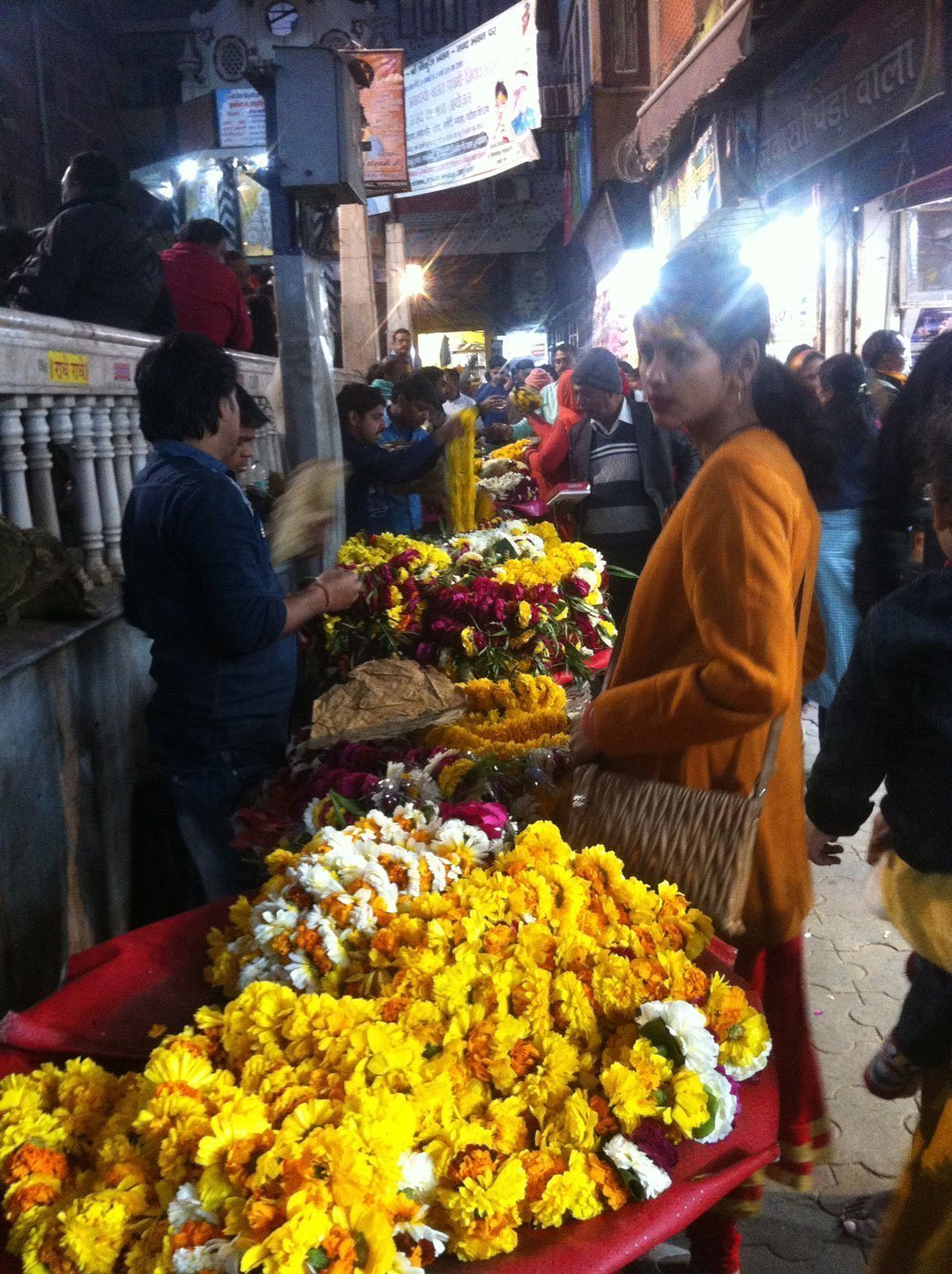 Buying flower garlands to offer in Banke Bihari Temple, Vrindavan