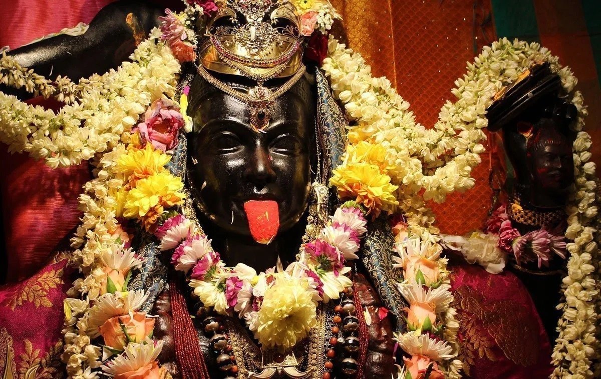 Kali with flower garlands at Skanda Vale