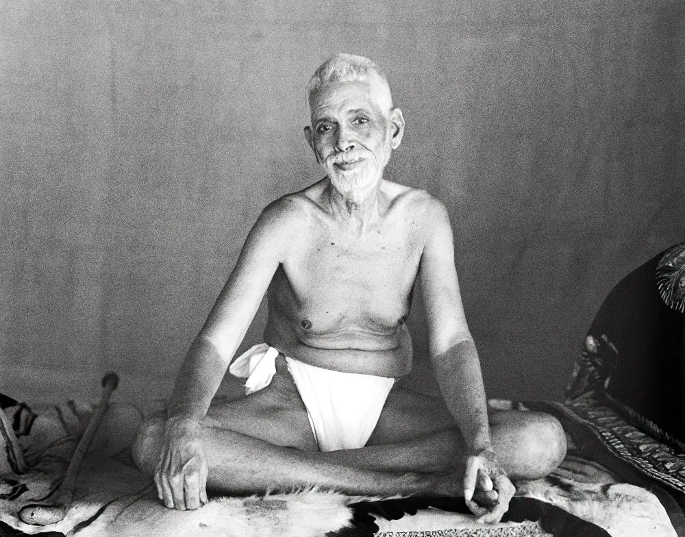 Sri Ramana Maharshi seated on his couch