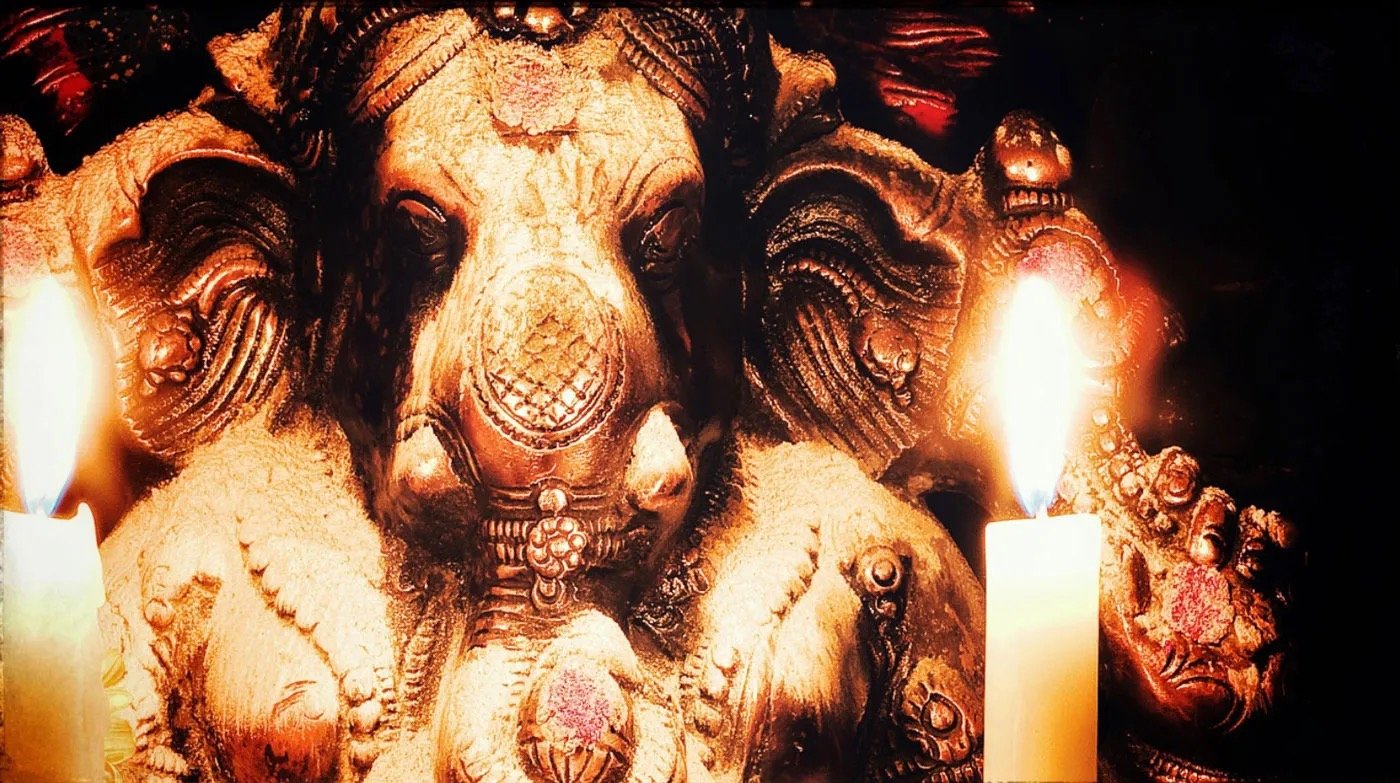 Lord Ganesh A murthi of Ganesh with vibhuti and a candle