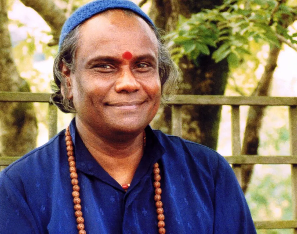 Guru looking at the camera smiling
