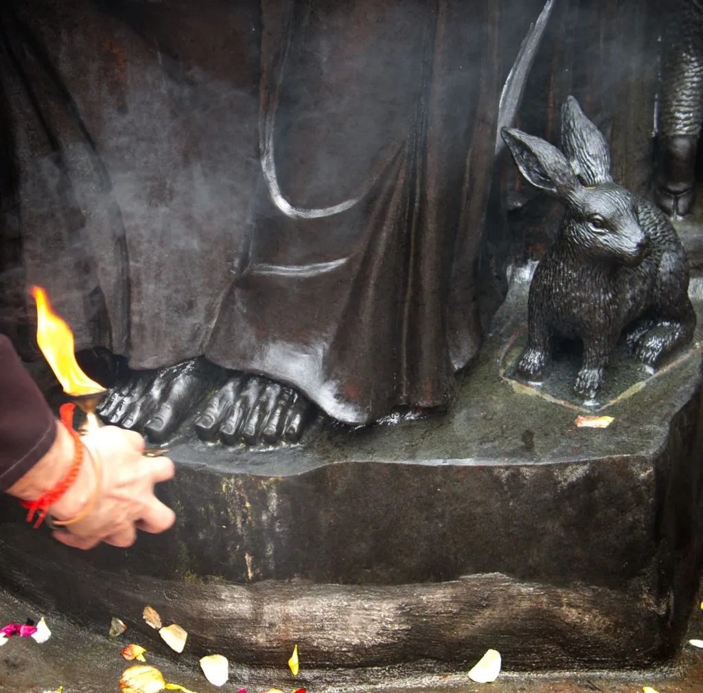 The feet of a statue of St Francis
