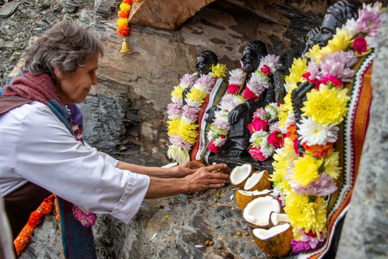 Statues of the five saints with flower garlands